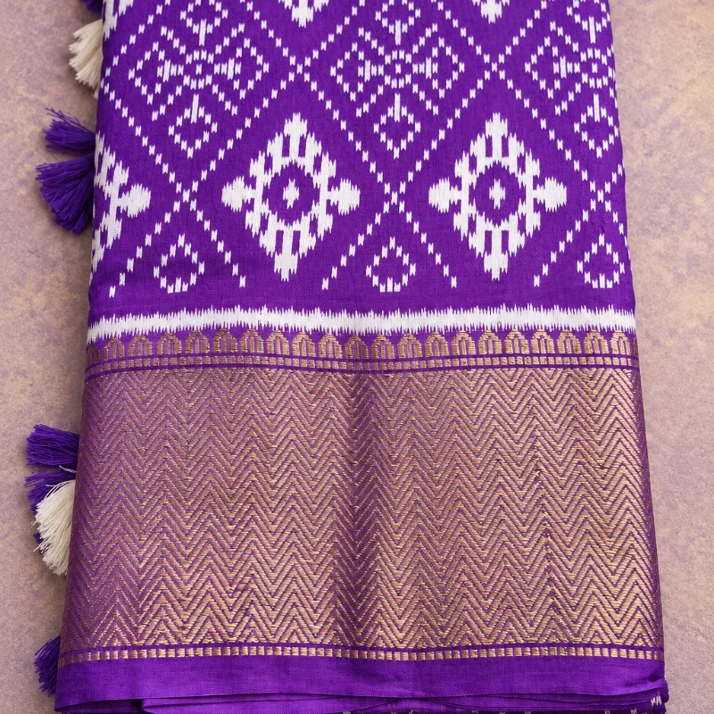 Elegant Purple & White Patola Cotton Silk Saree with a rich, textured golden Zari border
